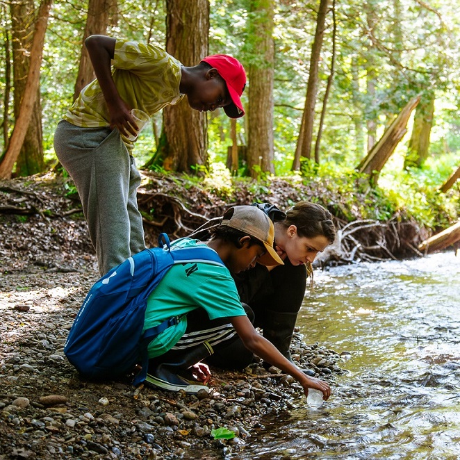 students take part in a stream study during a field trip to Claremont Nature Centre